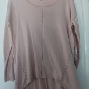 JENNIFER LOPEZ LONGER SWEATER WITH SPARKLES ON IT